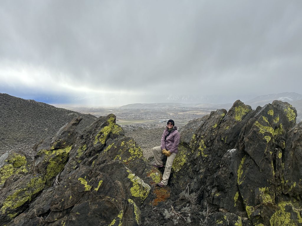Standing on a rocky crag near the top of Prison Hill in Carson City