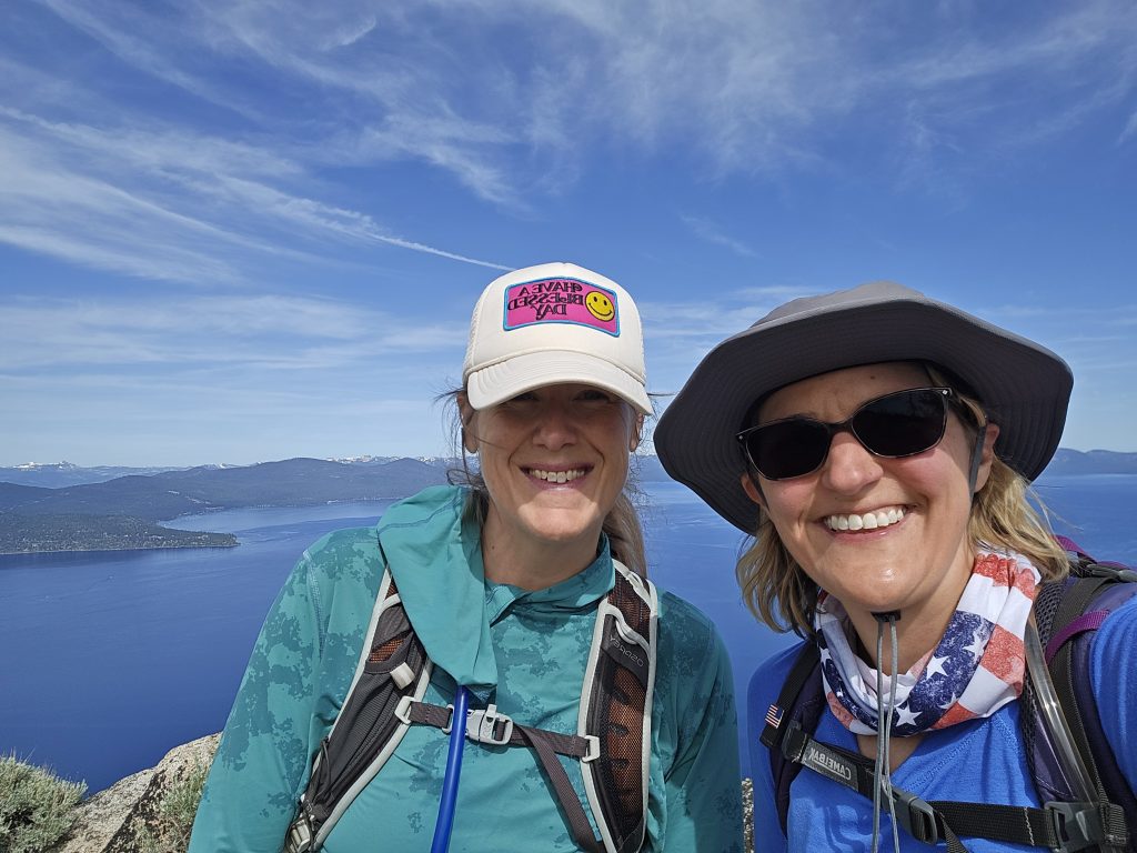 Standing at the top of Herlan Peak overlooking Lake Tahoe