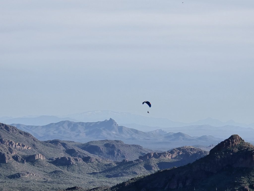 Paraglider flying near the Wave Cave trail in Arizona