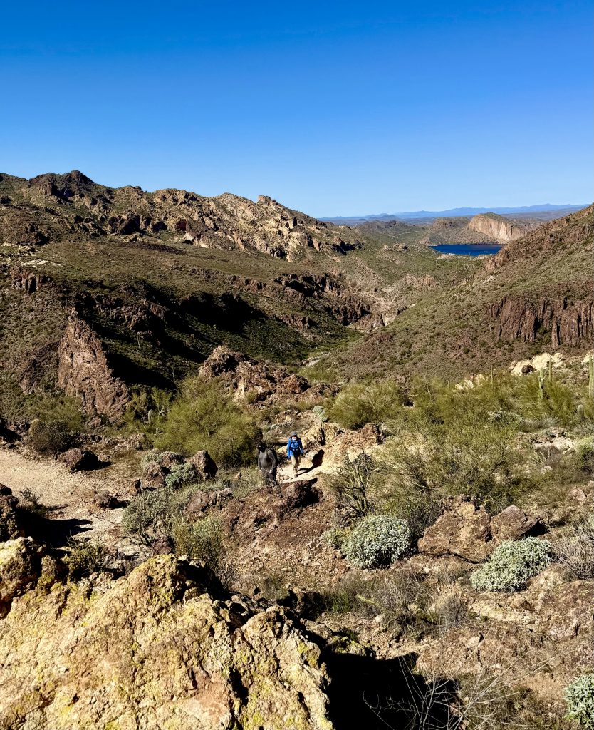 Hiking on the Boulder Canyon trail with Canyon Lake in the background