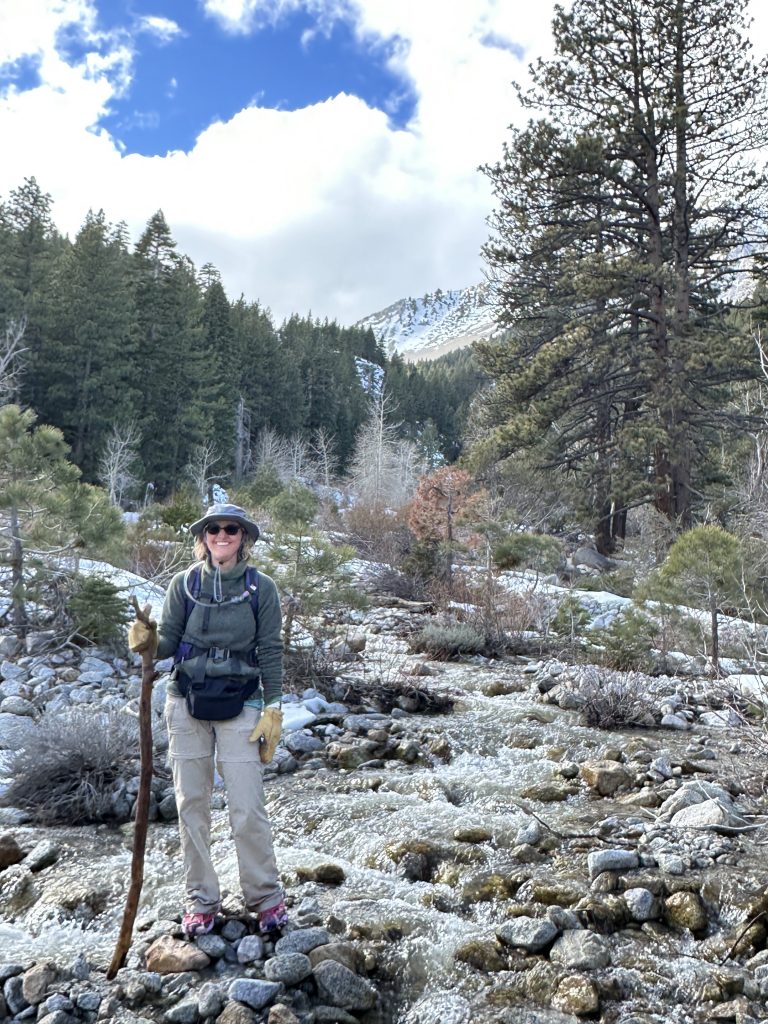 Standing with a walking stick at Ophir Creek