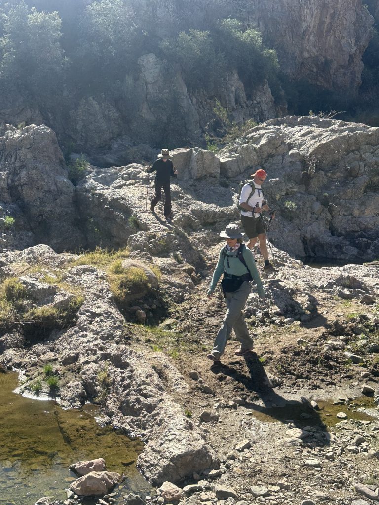 Crossing what's left of a creek in a wash on the Picketpost Mountain Loop hike in Arizona